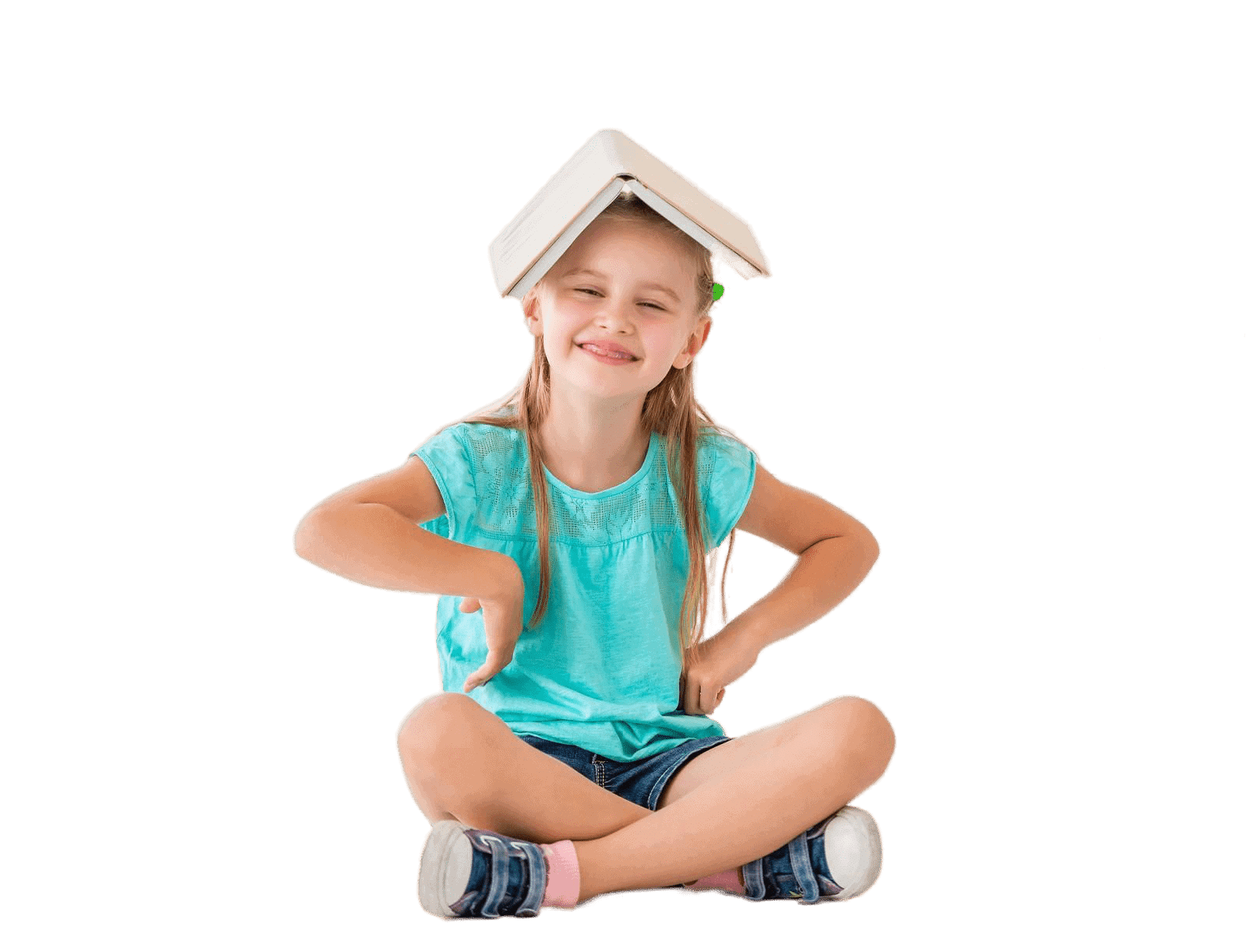 Young girl with a book on her head