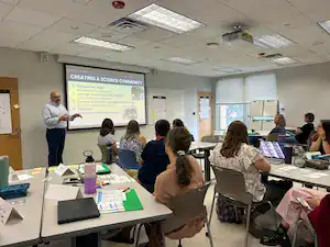 Educator presenting to a group of teachers during a CTLG science workshop at UNCG